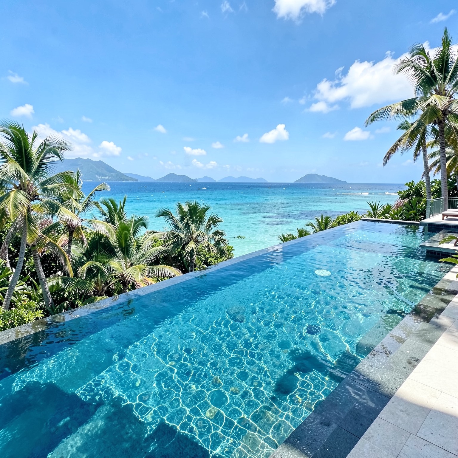 luxury infinity pool overlooking tropical paradise