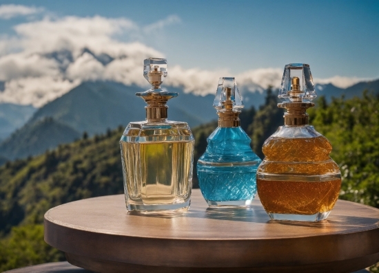 Sky, Cloud, Drinkware, Mountain, Liquid, Perfume